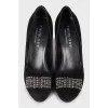 Suede shoes decorated with a bow