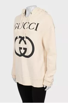 Beige hoodie with brand logo