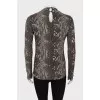Animal print blouse with brooch