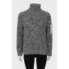 Knitted sweater with pocket on sleeve