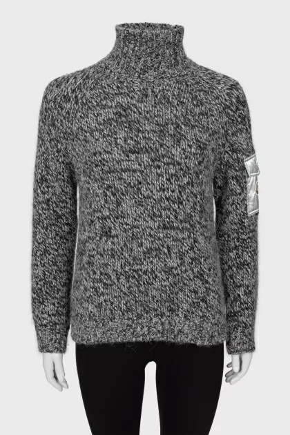 Knitted sweater with pocket on sleeve