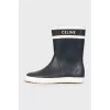 Rubber black and white boots