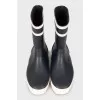 Rubber black and white boots