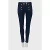Dark blue jeans with gold buttons