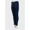 Dark blue jeans with gold buttons