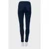 Dark blue jeans with gold buttons
