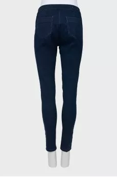 Dark blue jeans with gold buttons