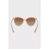 Sunglasses with gold hardware