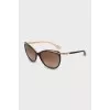 Sunglasses with gold hardware