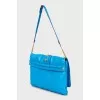 Blue clutch bag with gold hardware