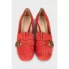 Suede pumps with fringe and logo