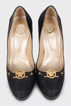 Textile shoes with branded decor