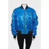 Blue bomber jacket with draped sleeves