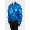 Blue bomber jacket with draped sleeves