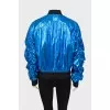 Blue bomber jacket with draped sleeves