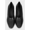Black shoes with a shaped heel 