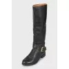 Black leather boots with buckle