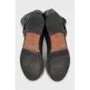 Black leather boots with buckle