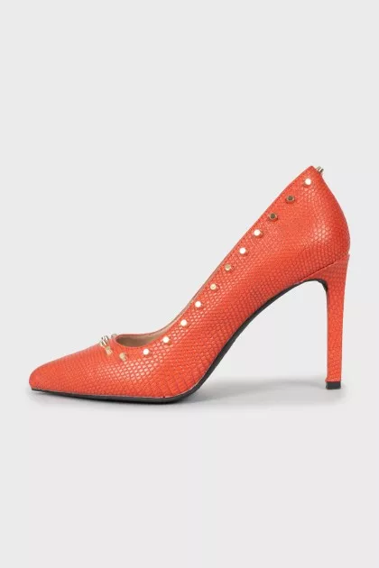 Leather shoes decorated with spikes