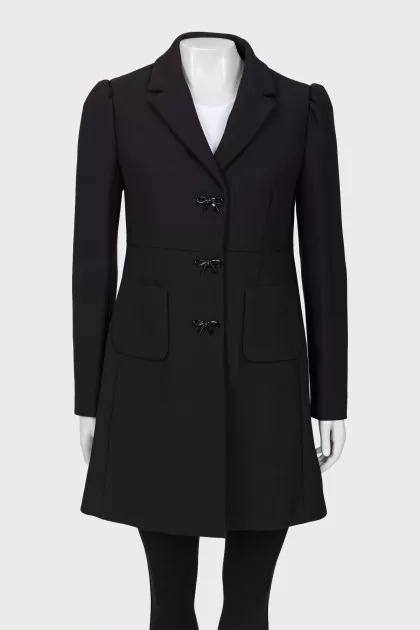 Coat decorated with bows