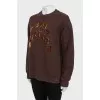 Brown sweatshirt with appliqué
