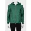 Green windbreaker with silver hardware