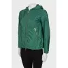 Green windbreaker with silver hardware