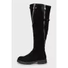 Suede boots decorated with zippers