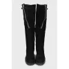 Suede boots decorated with zippers