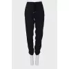 Black trousers decorated with sequins