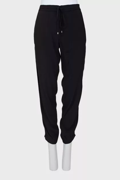 Black trousers decorated with sequins