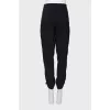 Black trousers decorated with sequins