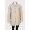 Quilted coat with press-studs closure 