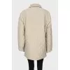 Quilted coat with press-studs closure 