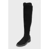 Black boots decorated with pearls