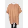 Beige poncho with press-studs closure 
