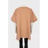 Beige poncho with press-studs closure 