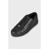 Leather sneakers with branded embossing