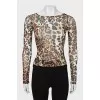 Translucent top in animal print