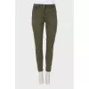 Khaki jeans with raw hem