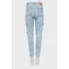 Light blue jeans with patches