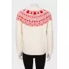 Milky sweater with red pattern