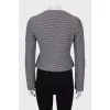 Fitted jacket with bias fastening