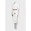 White dress with a pattern on the hem