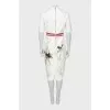 White dress with a pattern on the hem