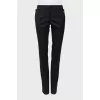 Wool trousers with decorated buttons