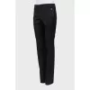 Wool trousers with decorated buttons