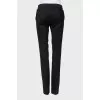 Wool trousers with decorated buttons
