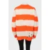 Knitted sweater with ripped effect