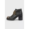 Black boots with gold toe
